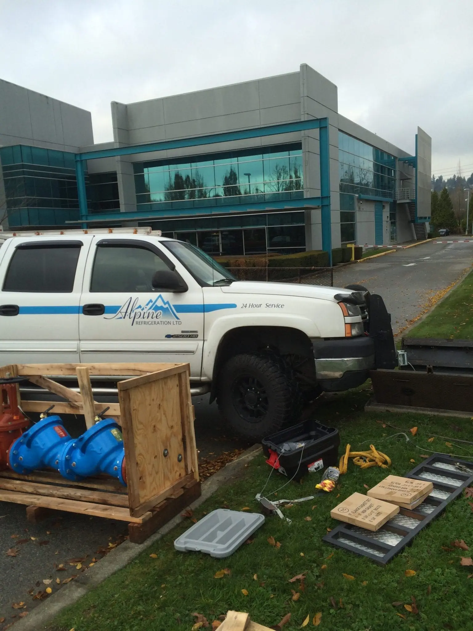 Alpine Refrigeration pickup truck with backflow prevention equipment at commercial building