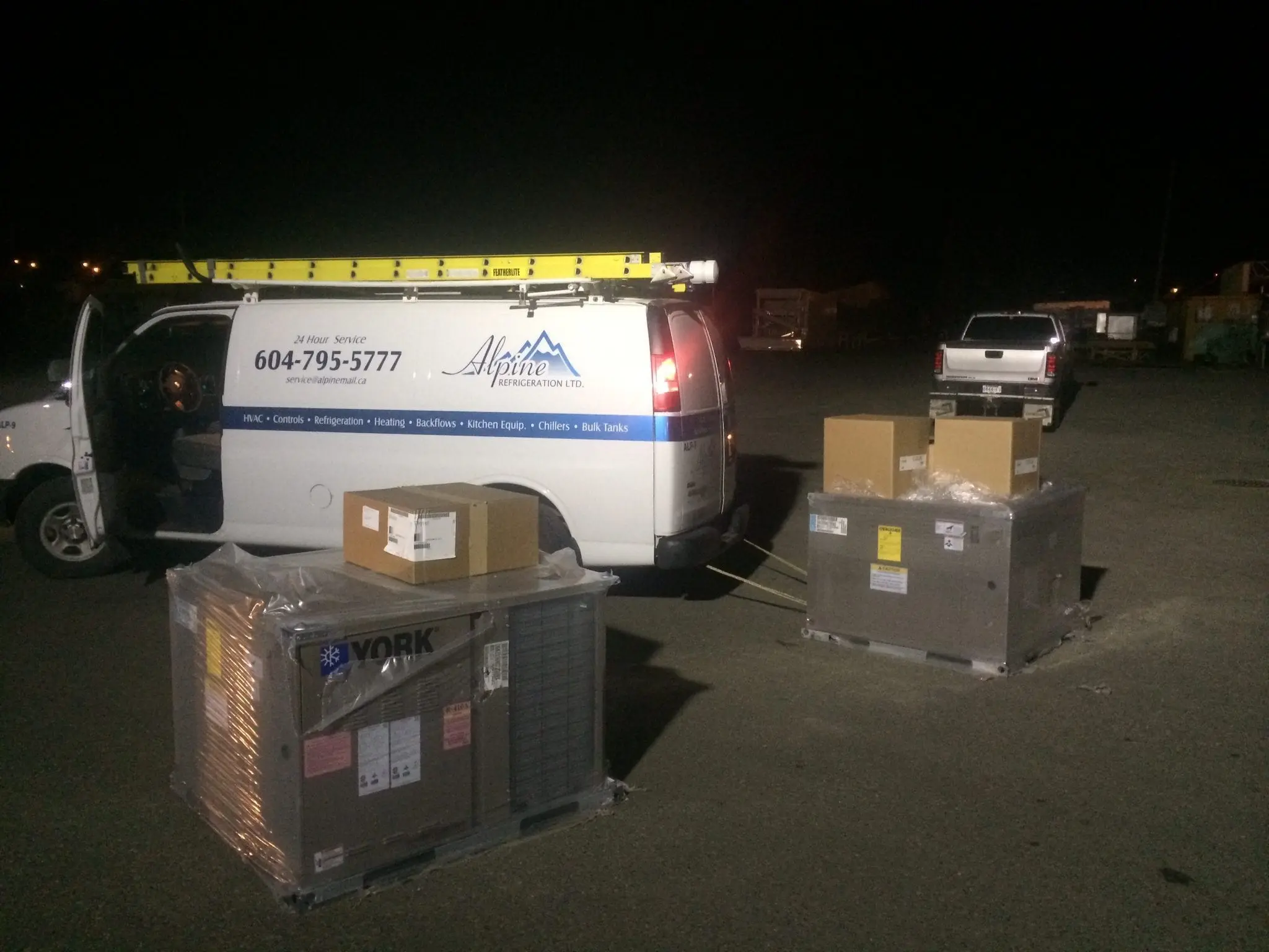 Alpine Refrigeration van loading York HVAC equipment for night emergency service