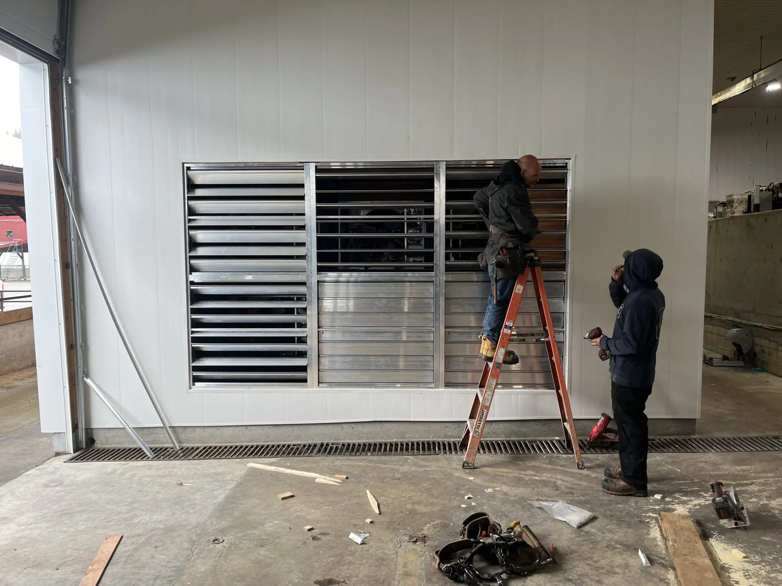 Alpine Refrigeration technicians installing ventilation louvers at agricultural facility Chilliwack BC