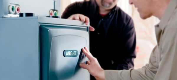 Heat pump installation technician servicing AirEase unit Chilliwack Fraser Valley Alpine Refrigeration