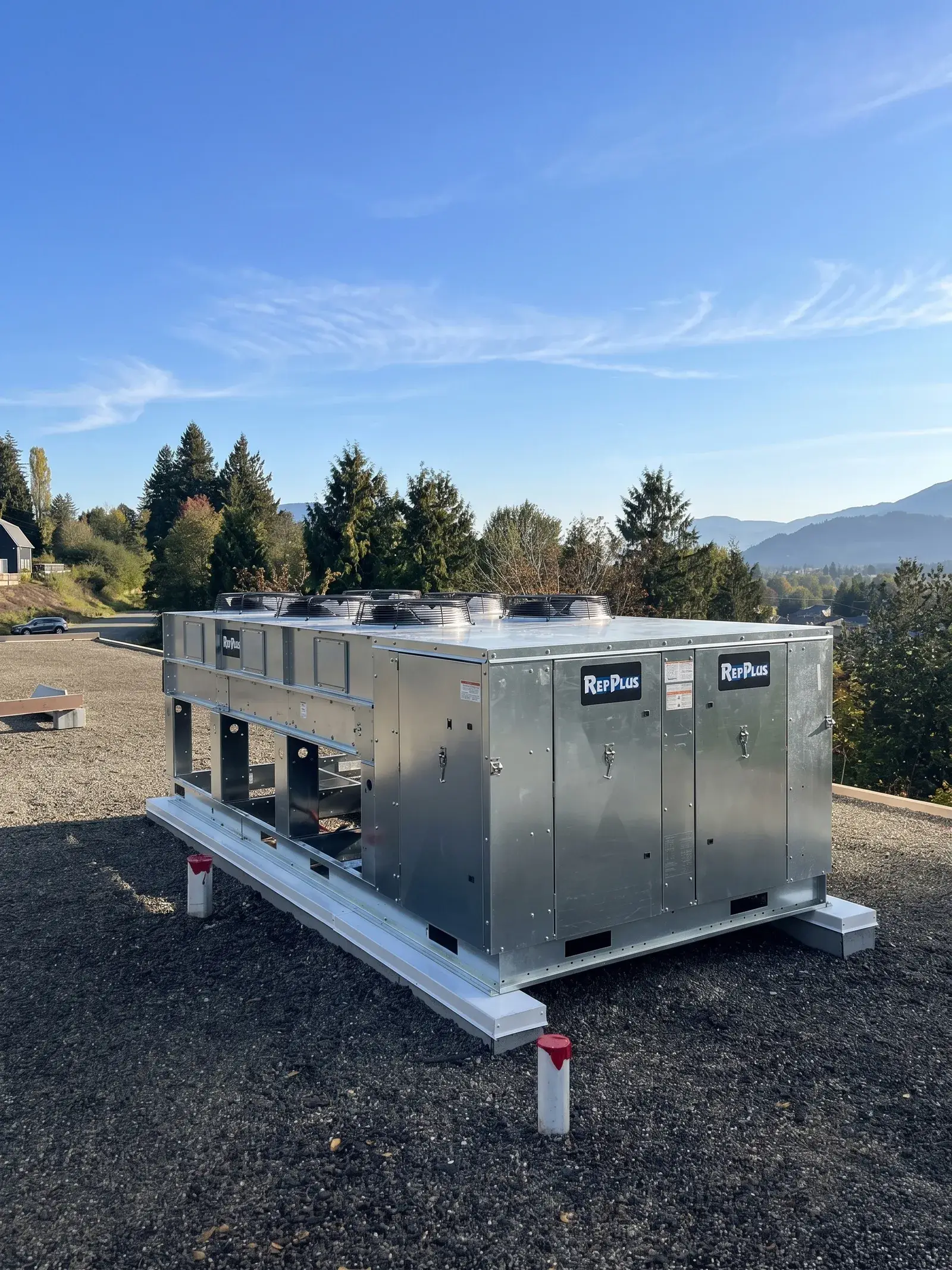 Custom multi-stage commercial refrigeration system installed on a rooftop curb in the Fraser Valley