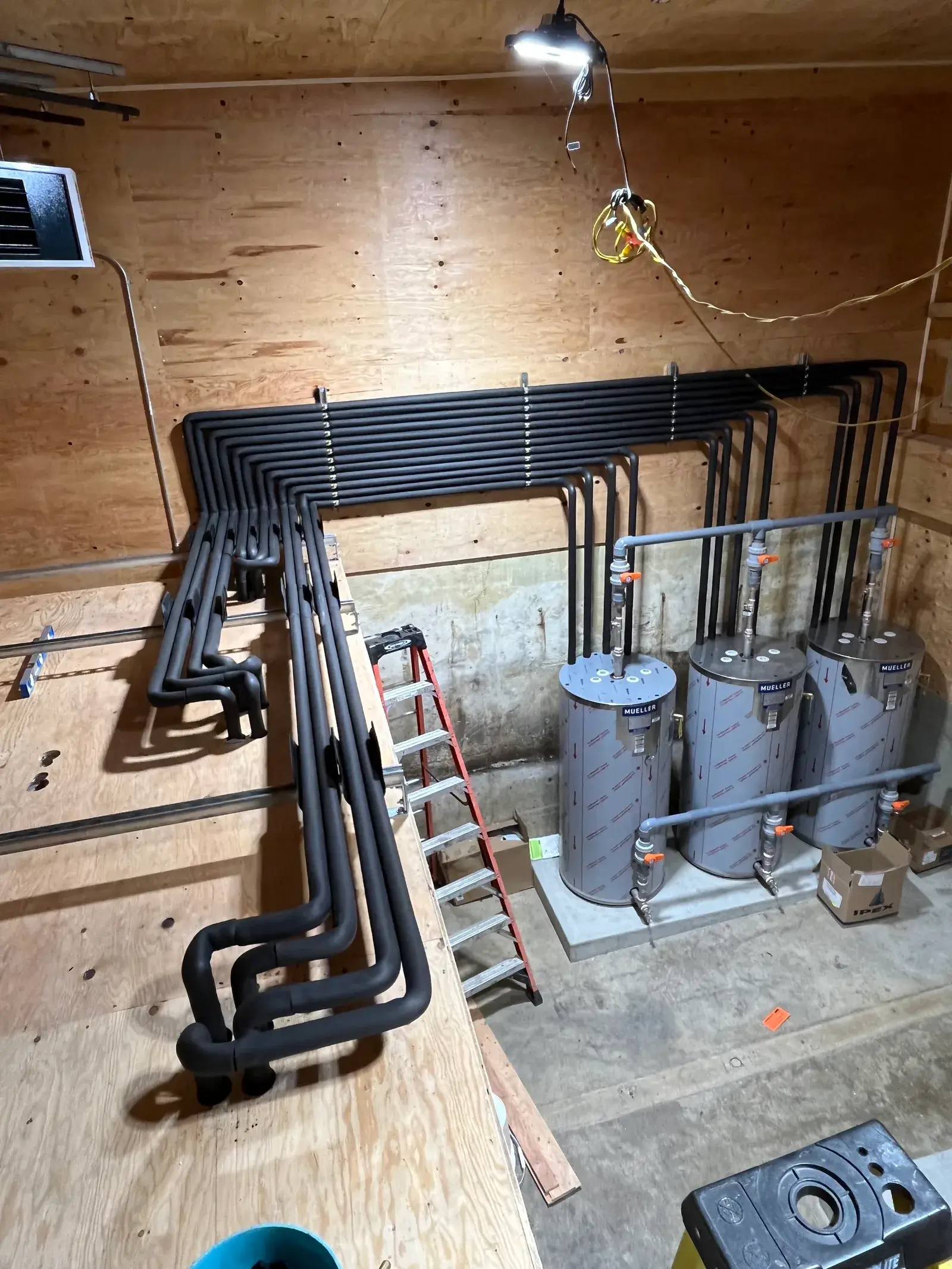 Glycol piping on the heat-recovery loop inside the new Gracemar Farms refrigeration plant