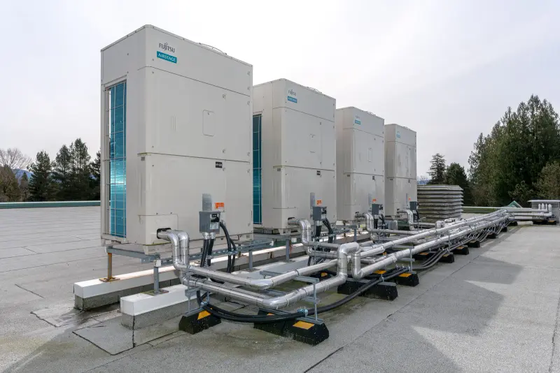 Insulated refrigerant headers running between units