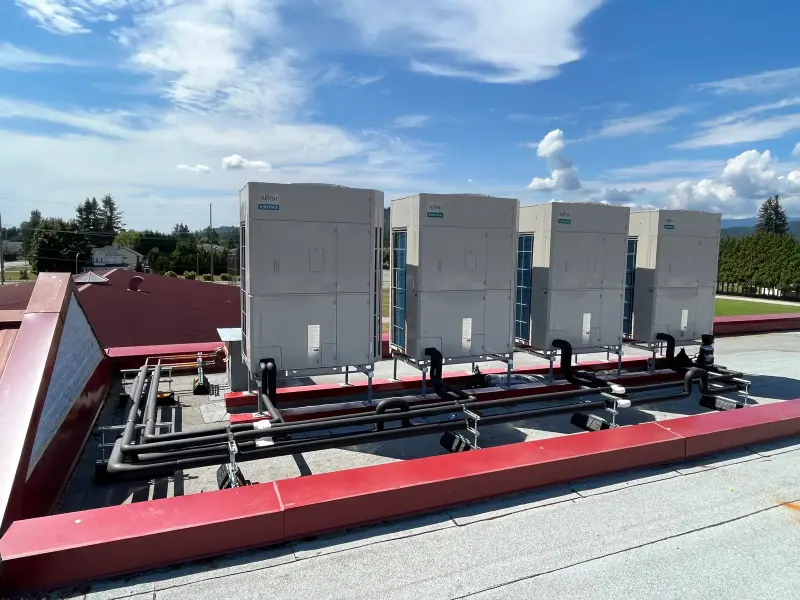 Four-unit bank with black-jacketed piping, second school