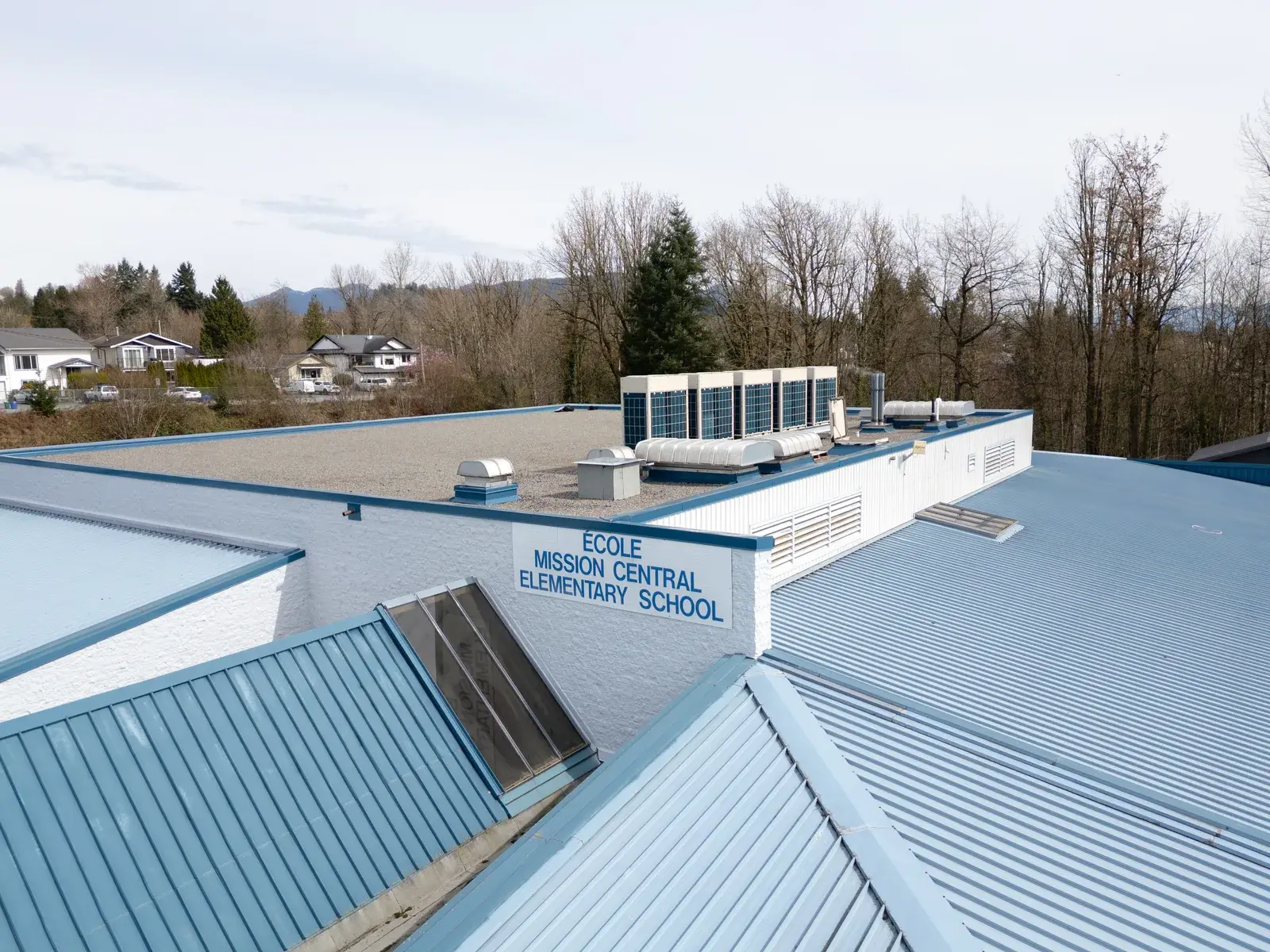 Rooftop view of Ecole Mission Central Elementary School with Fujitsu AIRSTAGE VRF condenser units installed by Alpine Refrigeration