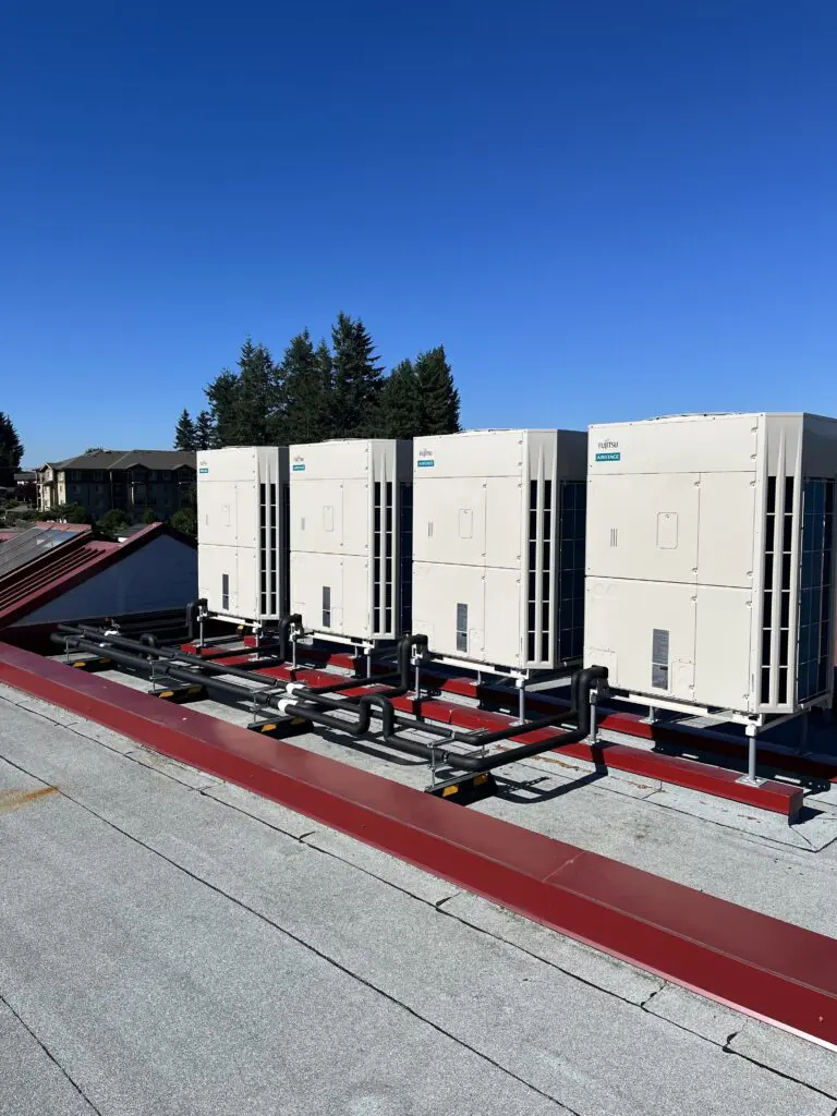 Aluminum-jacketed refrigerant line fittings installed during Mission Schools hybrid heat pump retrofit Chilliwack Abbotsford Fraser Valley BC