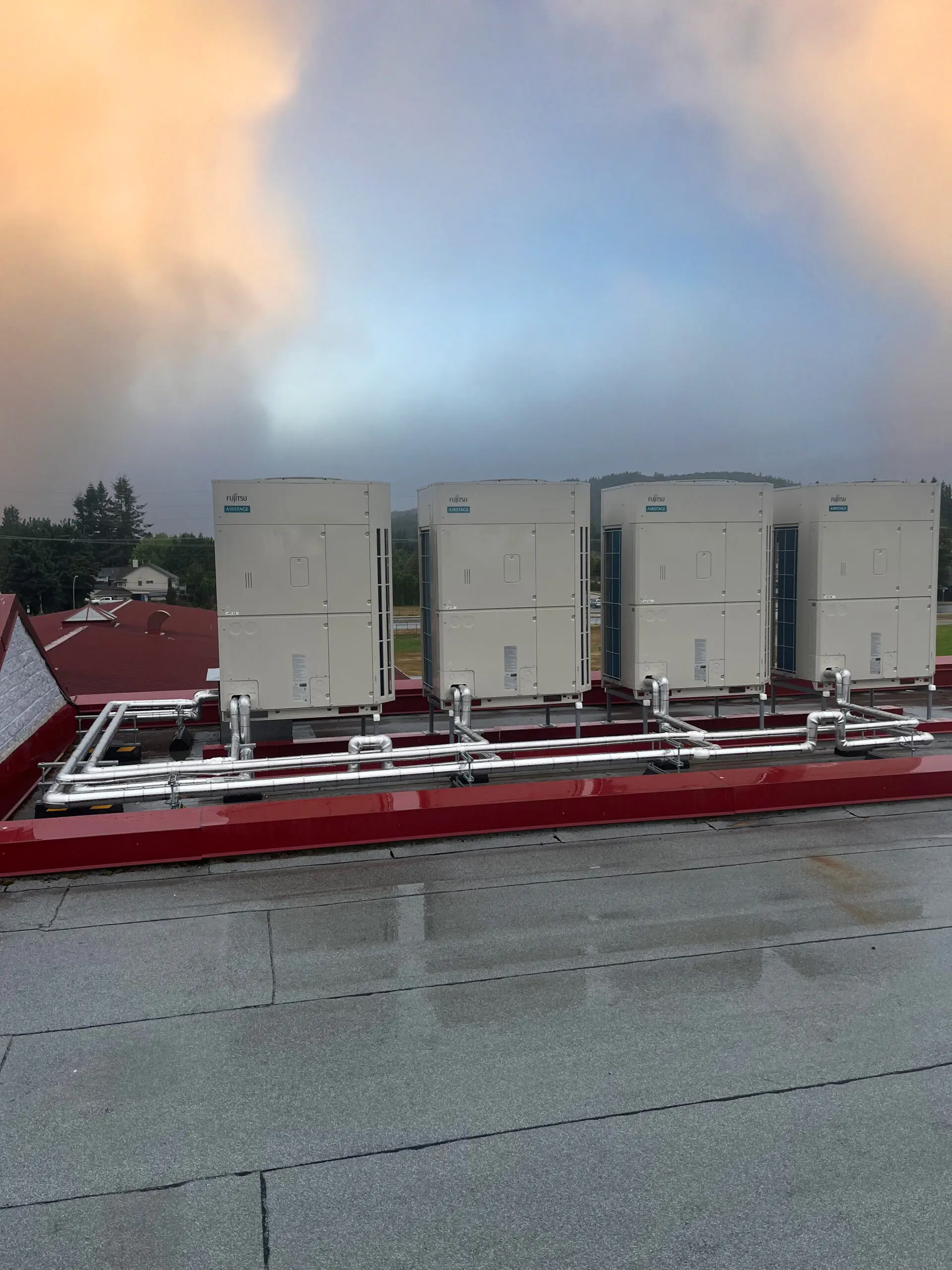 Hybrid heat pump system components and refrigerant piping at Mission Schools SD75 retrofit project Fraser Valley BC