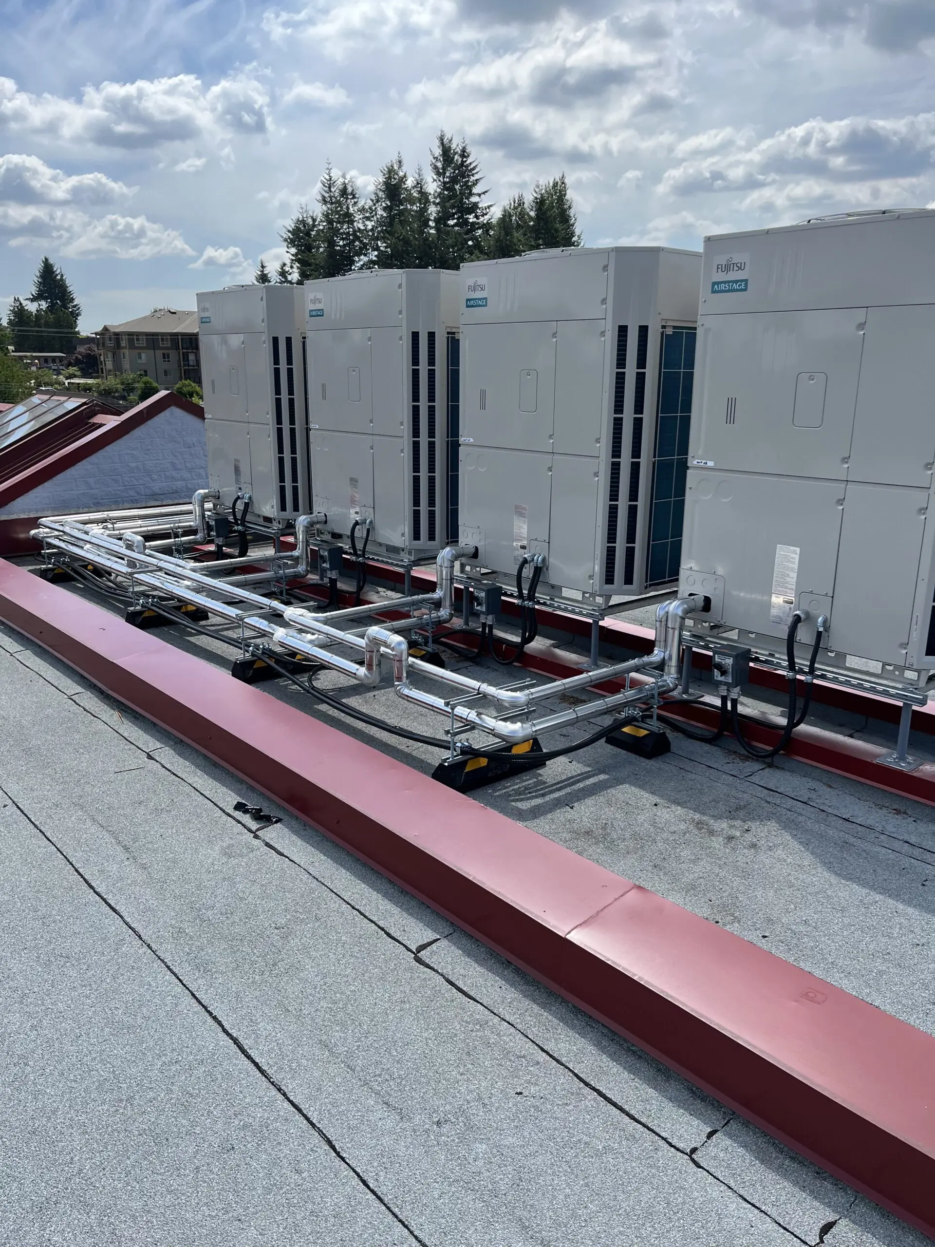 Mission School HVAC hybrid heat pump retrofit system with custom coils and modulating controls installed by Alpine Refrigeration